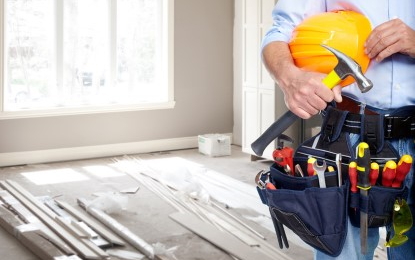 Tool belt with a hammer and hard hat
